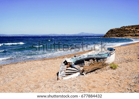 Sea wave and vintage boat  in clean summer day at the beach