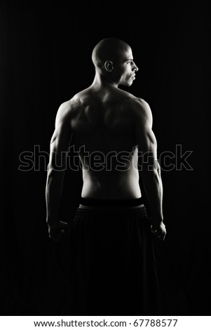 Artistic Fitness on a black background, Low key Royalty-Free Stock Photo #67788577