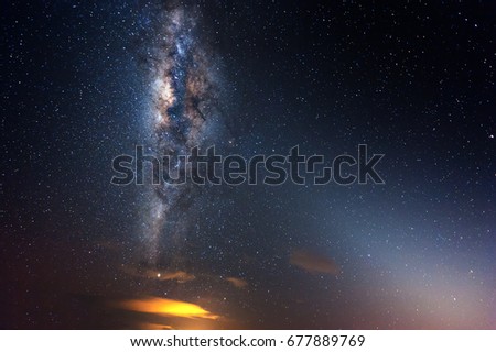 Starry night sky with Milky Way. Image contain soft focus and blur due to long expose and wide aperture. Image also contain noise and grains due to high ISO.