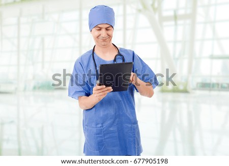 male doctor with tablet pc, at the hospital