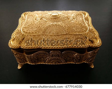 golden box isolated on black background


