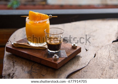 Fresh orange juice and intense Colombia coffee on wood tray served with orange grill
 Royalty-Free Stock Photo #677914705