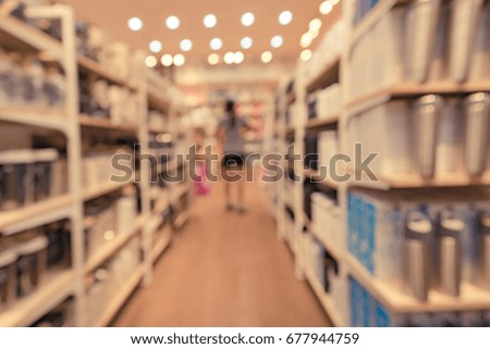 Abstract blurred image of people in retail shop for background usage