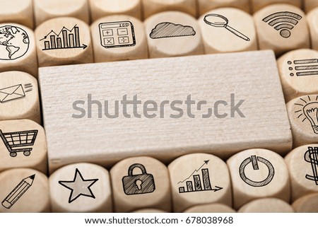 Full frame shot of wooden block surrounded by various computer icons