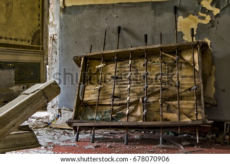 an old wood table football game against a ruined wall in an abandoned villa of nineteenth century in italy