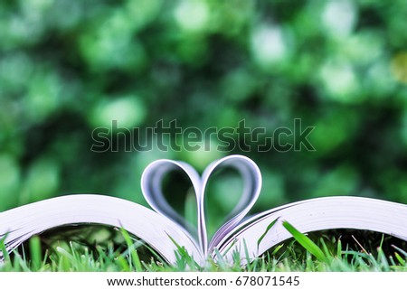 Book of love Heart shaped at the book with a blurry background.