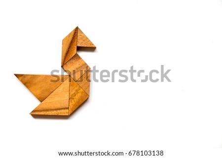 Wooden tangram puzzle in swan shape on white background