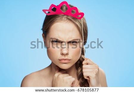 Woman with paper accessory on a blue background                               