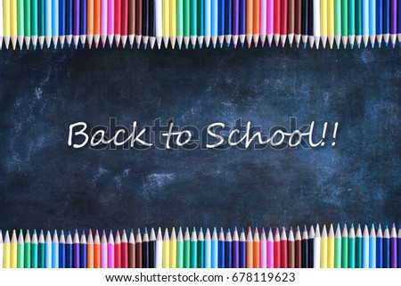 School chalkboard or blackboard and colored pencils with Back to School Text.