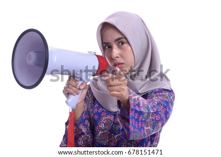 portrait of a young woman shouting with a megaphone against white background