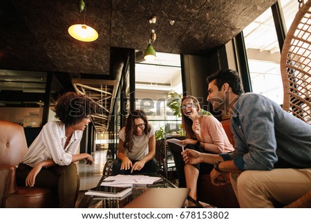 Team of corporate professionals having friendly discussion in a meeting. Multi ethnic business team having project discussion. Royalty-Free Stock Photo #678153802