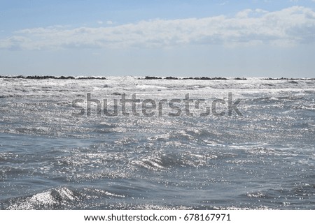 Beautiful view of sunlight in summer on stormy sea waves
