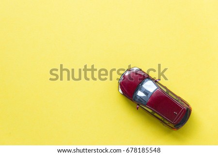 Car model on yellow background with copyspace, image can be used for car rental and car insurance and travelling concept