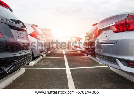 A row of new cars parked at a car dealership stock Royalty-Free Stock Photo #678194386