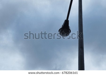 The power poles and atmosphere of the sky are filled with rain clouds before it rains.