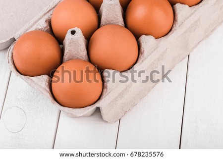 Egg, Chicken eggs in the package on a white background. Chicken eggs in a cardboard box.