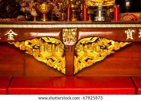 Wood carving patterns of Thai beautiful golden Singha(lion).
