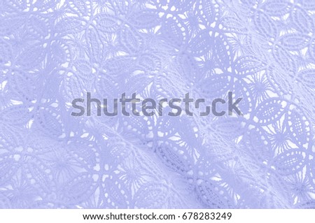 Image texture background, decorative lace with pattern. Blue pastel colors of lace fabric. Template for wedding, invitation or greeting card with blue lace background. Close-up of a wedding lac