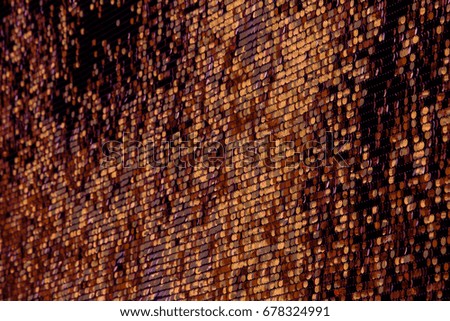 Abstract pixel background for creative design. Golden background of round gold discs chaotically rotating in wind. An unusual original chaotically changing background for design. Soft selective focus
