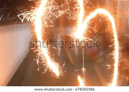 Heart shaped handy fireworks in a balcony.