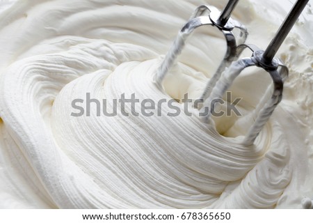 whipped cream and mixer Royalty-Free Stock Photo #678365650