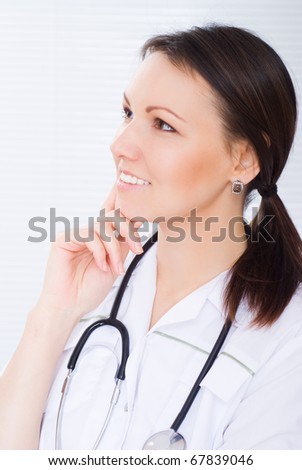 nice woman doctor stand on a white background
