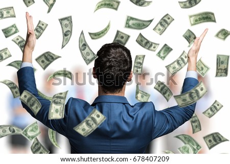 Portrait of an happy man in a rain of money