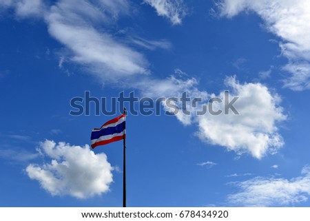 Flag of Thailand, Flying Thai flag with blue sky and sunlight background.