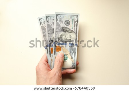 Hand offer three hundred dollars Royalty-Free Stock Photo #678440359