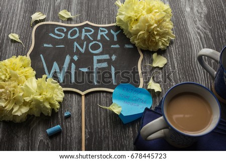  Handwritten Sorry No Wi-fi Signage with Yellow Carnation and Coffee Cups