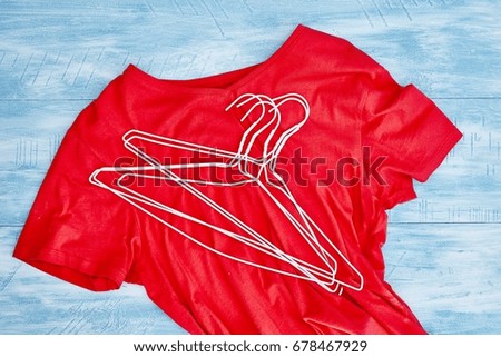 A studio image of coat hangers