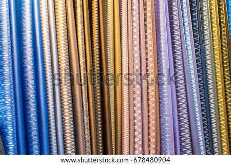 Stock Photo - A collection of Thai silk cloths at the weekend market.