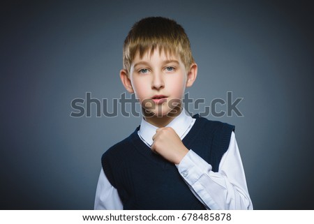 Closeup Portrait of boy going surprise isolated on gray background