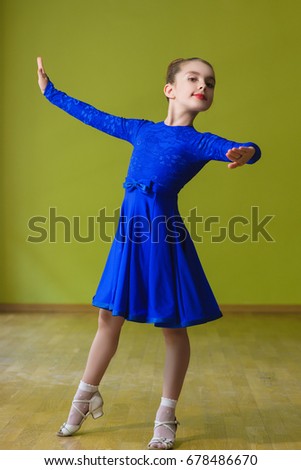 Little cute girl dancing ballroom dance