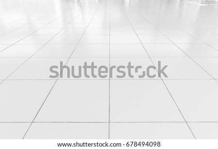 White tile floor clean and symmetry with grid line texture in perspective view for background. Flooring permanent covering by tile, Square shape of white tile made from ceramic material covering floor