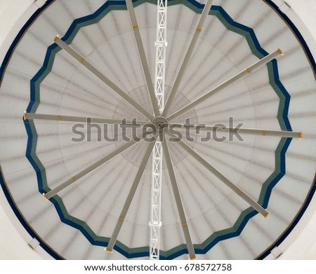 pattern background : inner view of a mosque dome with giant fan. picture taken from bottom
