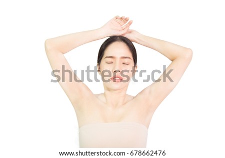 Beautiful young Asian woman show armpit that slick white , skin care and clean skin and spa concept , isolated on white background