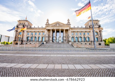 View on the famous Reichtag parliament building with flag during the morning light in Berlin city