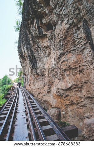 Death Railway. People in the picture. Nature and railroad tracks in a rural on a ridge or mountain. space. Kwai Noi River, Kanchanaburi, Thailand