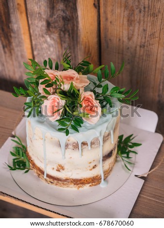 Big cake with rose flowers.