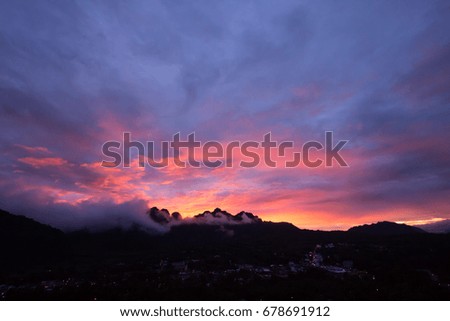 Silhouette, Beautiful Colorful Sunset Over Mountain Ranges.