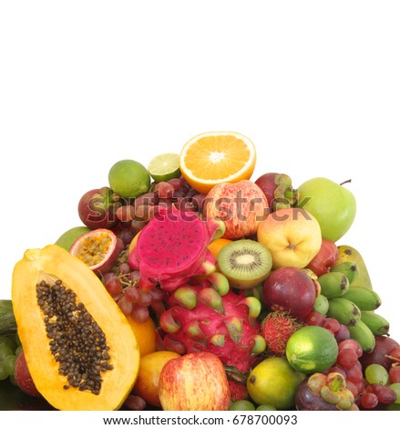 Big heap of ripe tropical fruits isolated on white