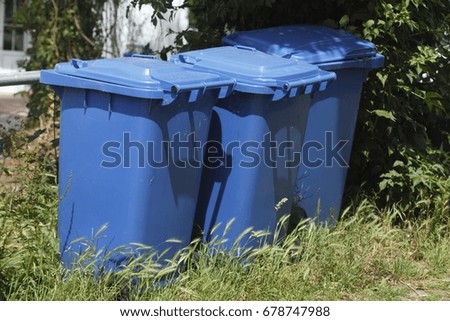 blue plastic recycling bins for waste paper