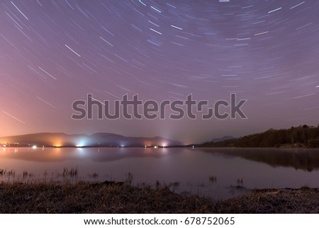 stars trailing around the sky over Loch Lomond Scotland