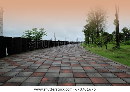 Brick worm/Lonely path/The walk in the park at dusk with orange glow on the horizon