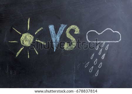 Sun VS clouds. Drawing chalk on a blackboard. Good and bad weather.