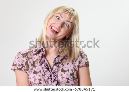 Portrait of crazy funny woman On a gray background