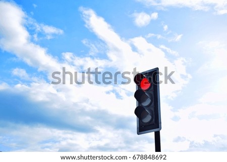 Traffic light and sky.