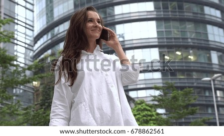 Happy businesswoman talking on phone