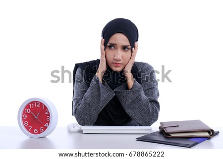 Portrait of beautiful female Asian student with hijab doing homework with deference expression face. 